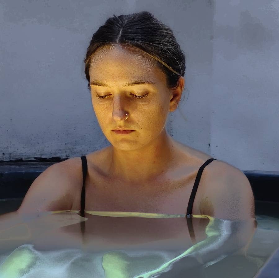 A guest breathing calmly in the ice bath at Tapas