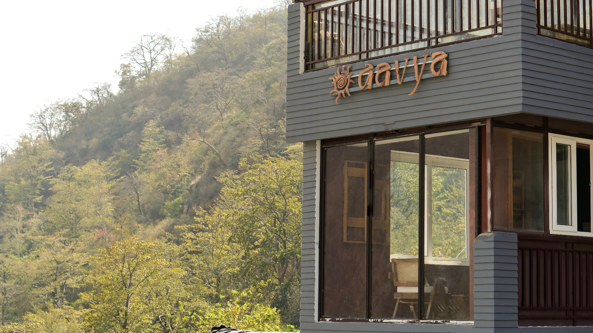 Aavya building exterior with Himalayan mountains