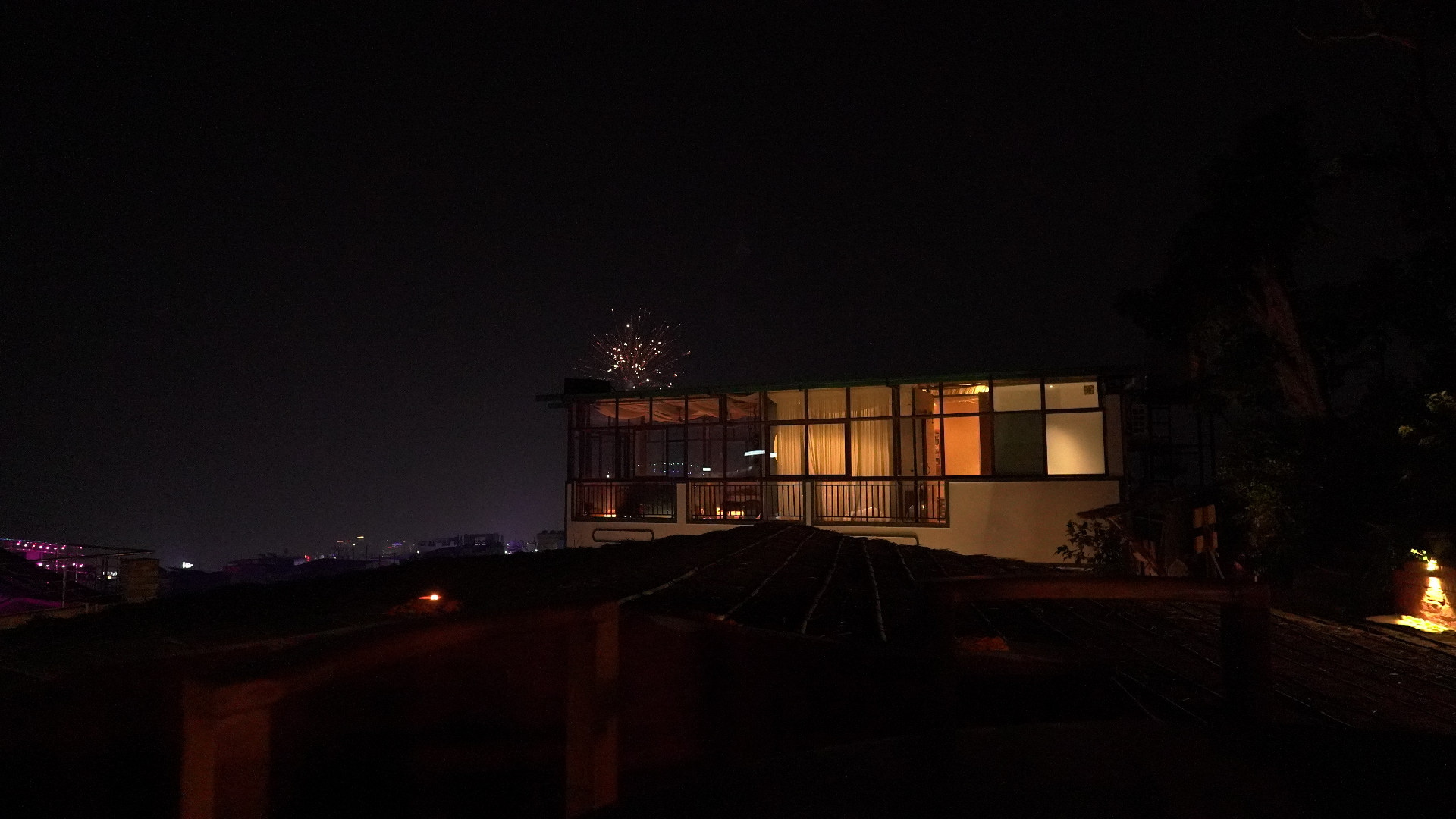 Aavya building at night with fireworks
