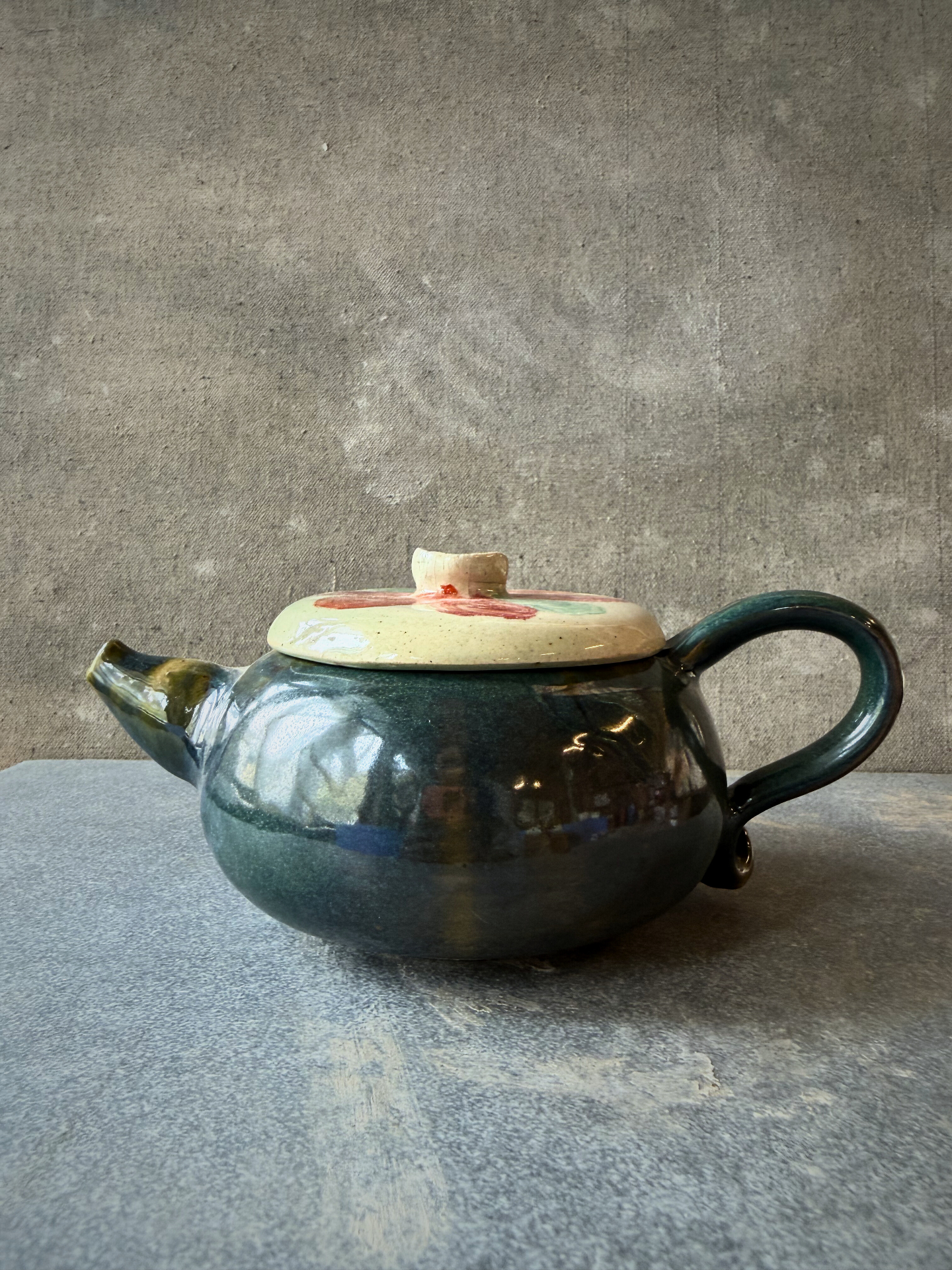 Handmade ceramic teapot with forest-green glaze from Aavya Pottery Studio, Rishikesh
