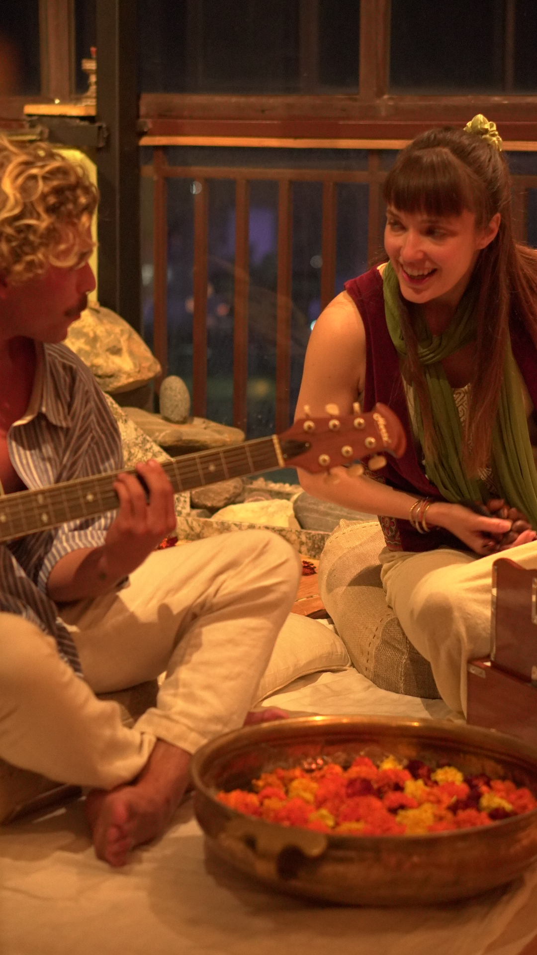 Guitar and flowers at gathering