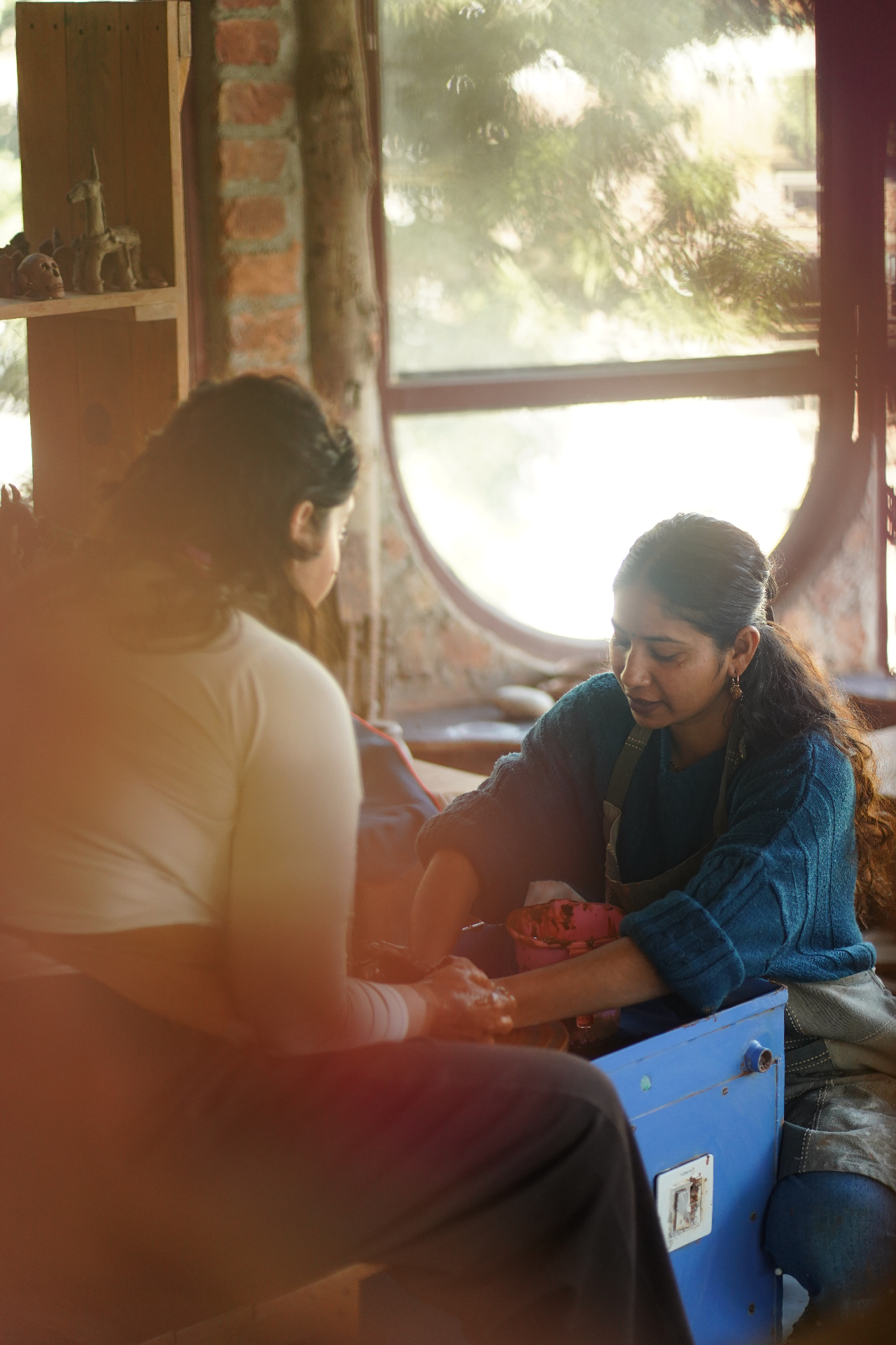Shivani teaching pottery class