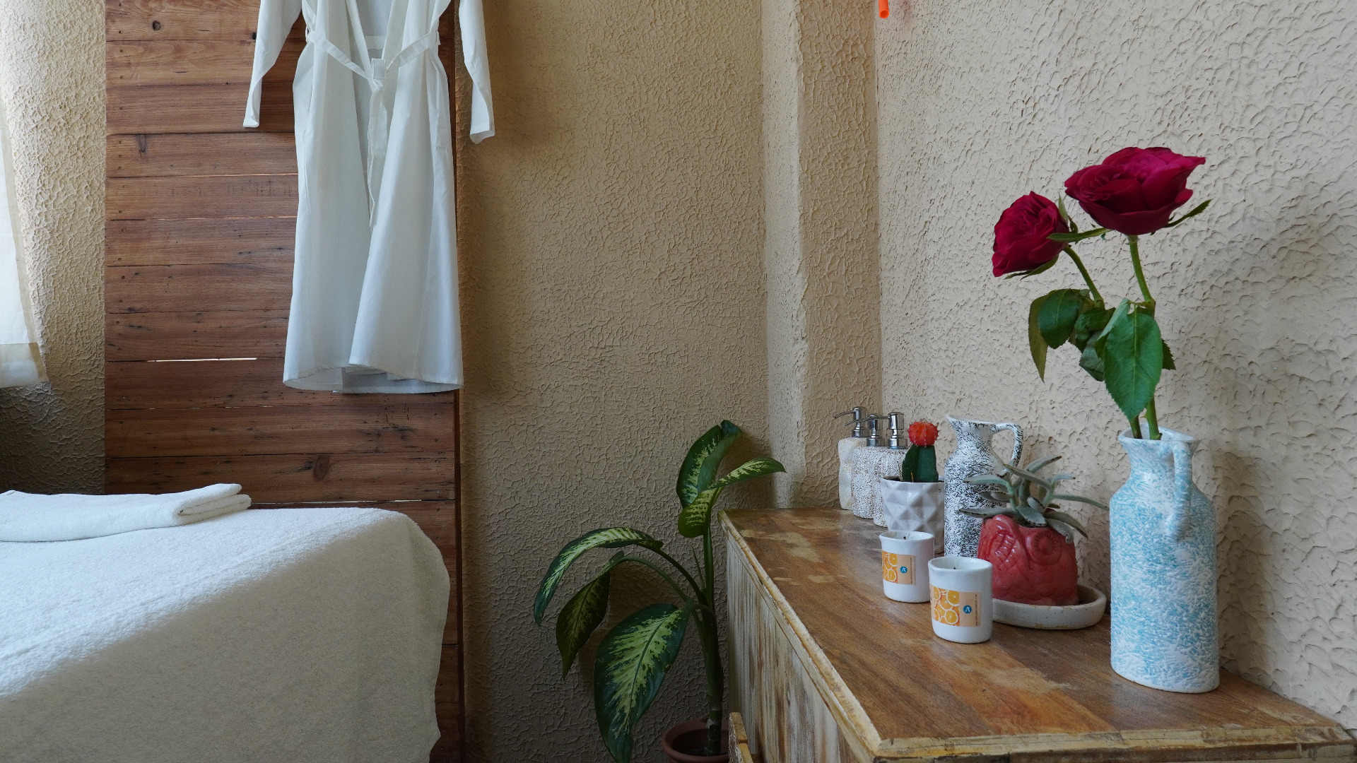 Spa room with roses and pottery