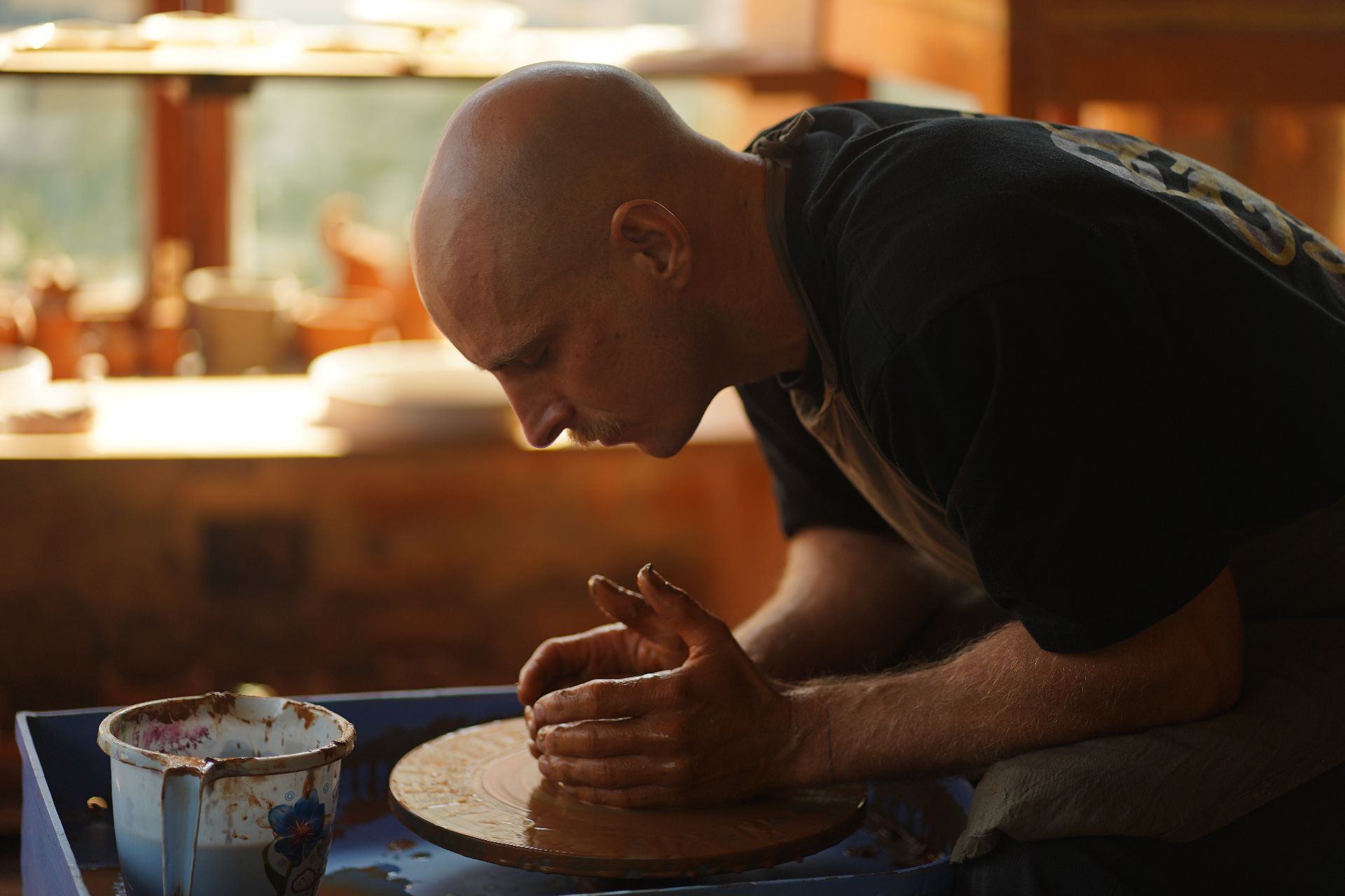 Student at the pottery wheel