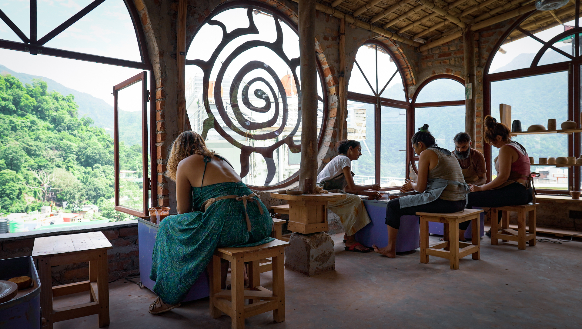 Hands on the pottery wheel in the Aavya studio