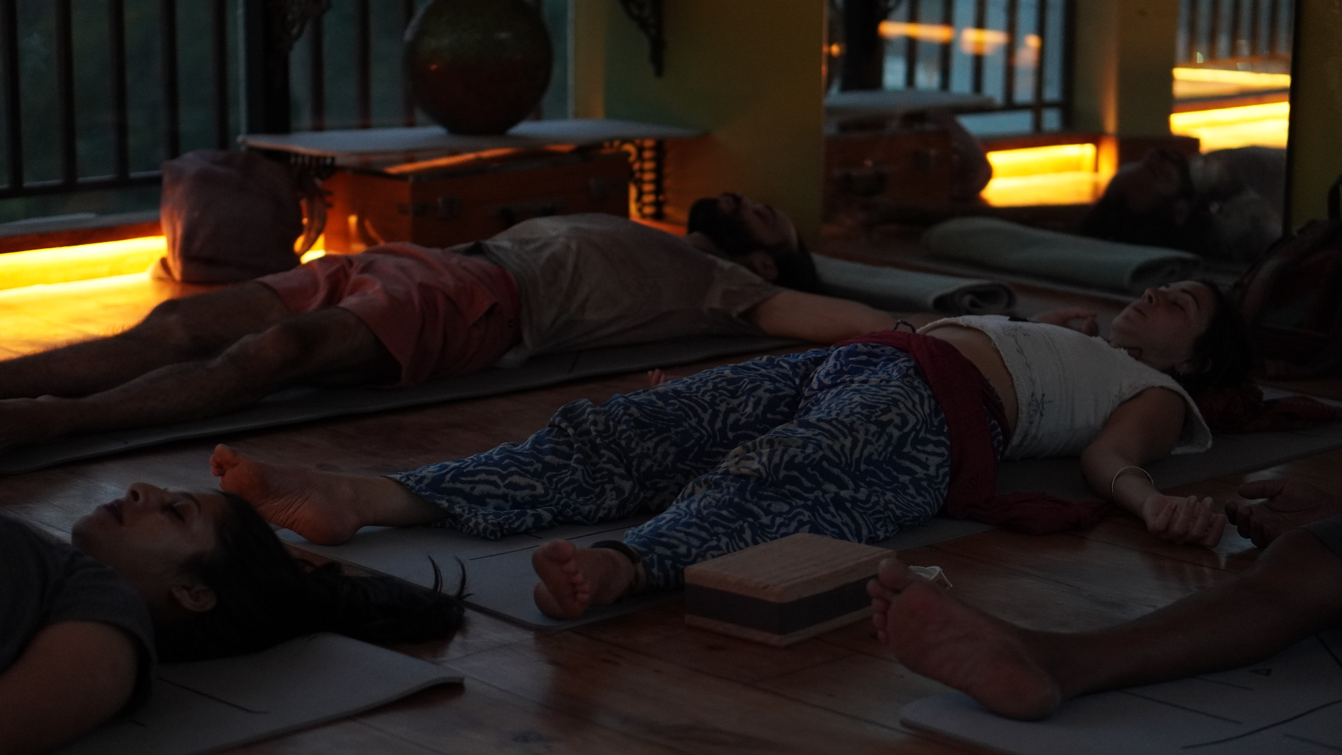 Guests lying down during a sound healing session